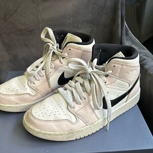Light pink and white Nike Jordans